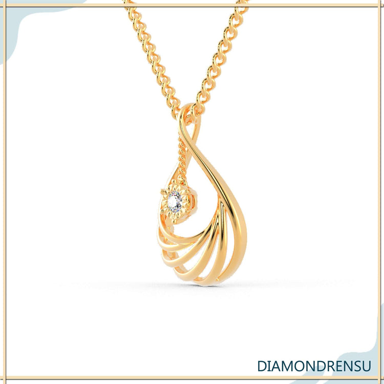The diamond teardrop pendant shines with brilliant clarity.
