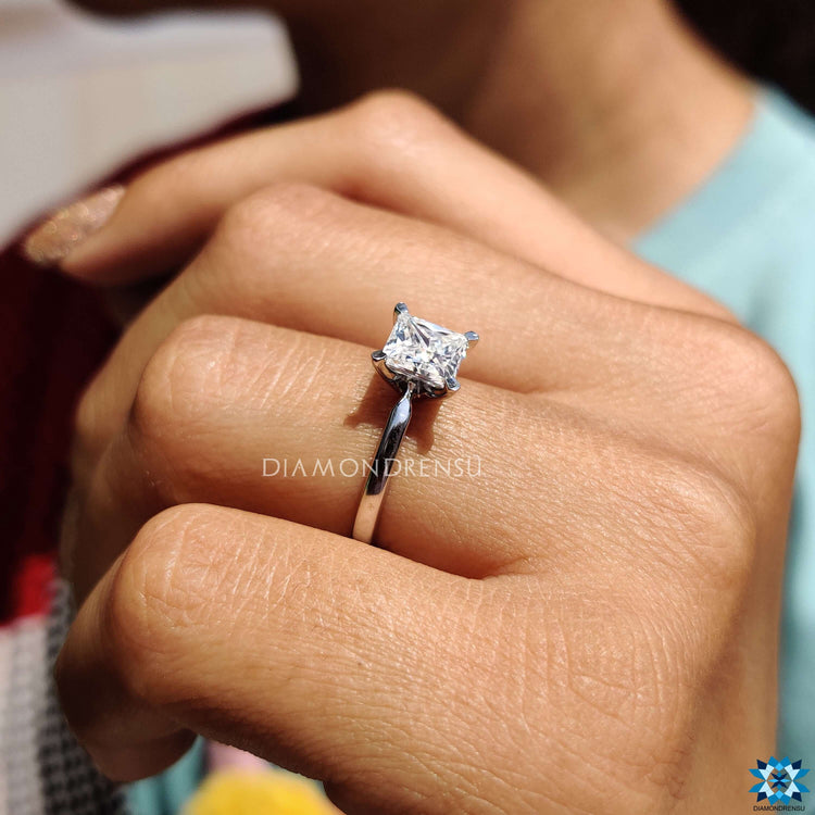 A beautiful moissanite solitaire ring radiating brilliance under natural light.