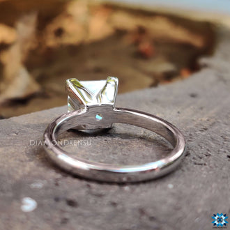 A solitaire ring setting with a radiant 2 ct princess cut moissanite, ideal for engagements.