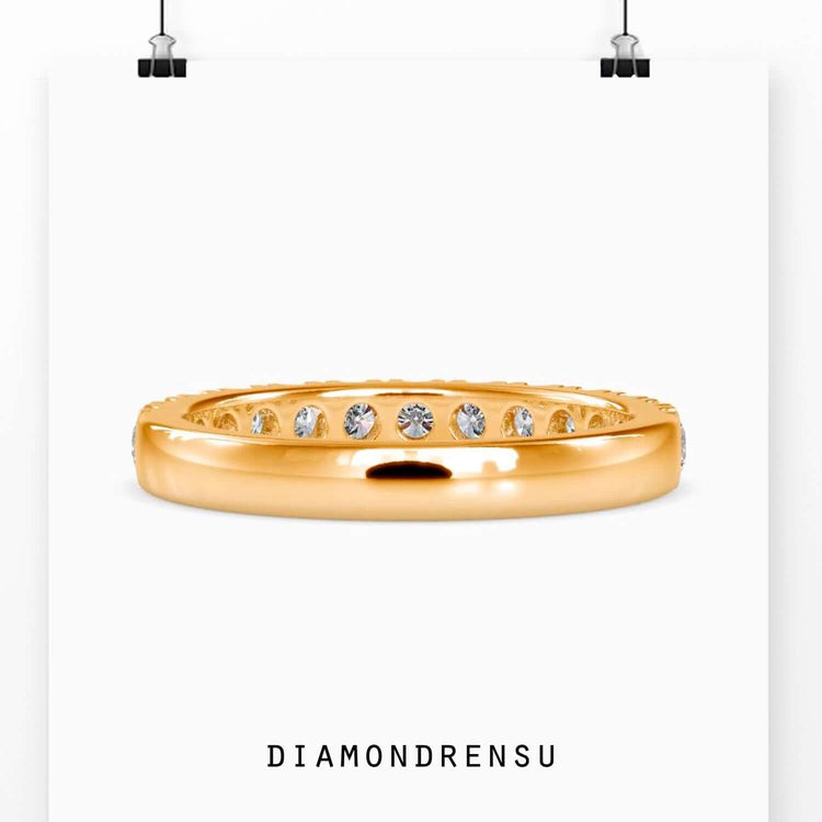 Half eternity wedding band with round cut diamonds in a French cut pave setting.
