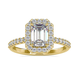Handmade emerald cut engagement ring with halo setting.