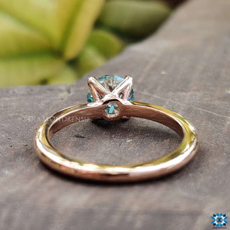 Beautiful handmade jewelry showcasing a unique blue moissanite.