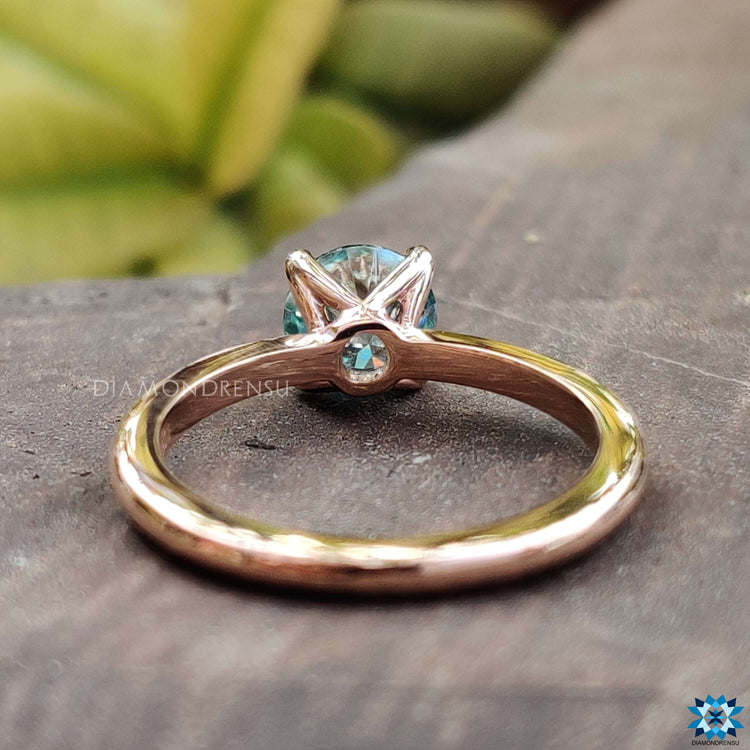 Beautiful handmade jewelry showcasing a unique blue moissanite.