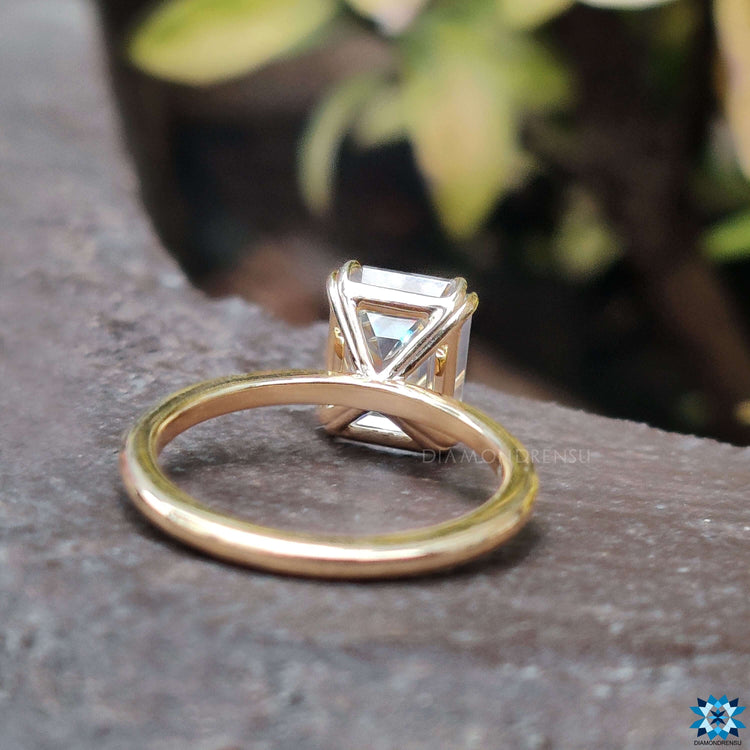 Moissanite emerald cut ring for a chic and sophisticated engagement look.
