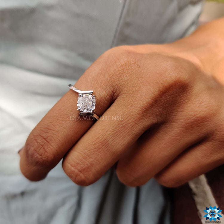 A cushion cut moissanite ring sparkling with brilliance, blending modernity with tradition.