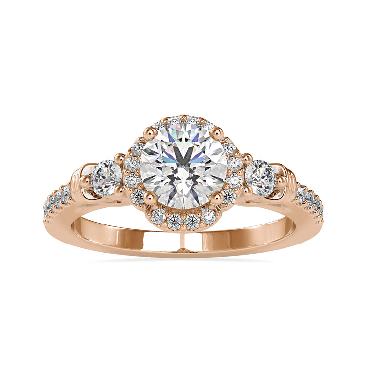 Round halo engagement ring with floral-inspired diamond details.
