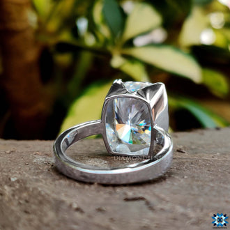 Half bezel cushion cut ring showcasing timeless beauty.