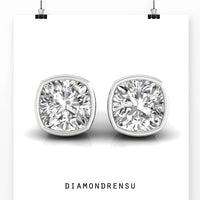 Stunning cushion cut earrings with a bezel set design, ideal for formal occasions.
