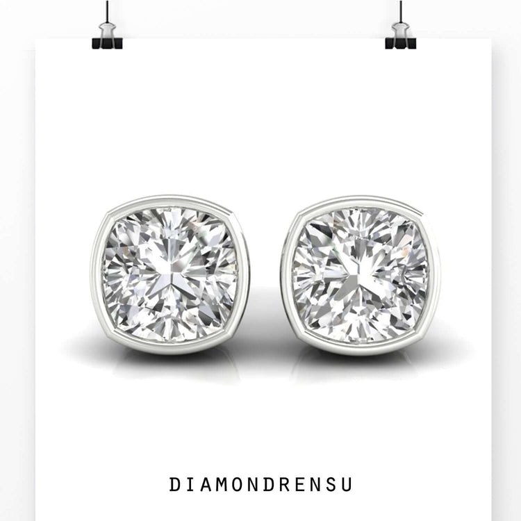 Stunning cushion cut earrings with a bezel set design, ideal for formal occasions.
