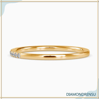 Lab diamond eternity ring in a minimalist band with handmade craftsmanship.
