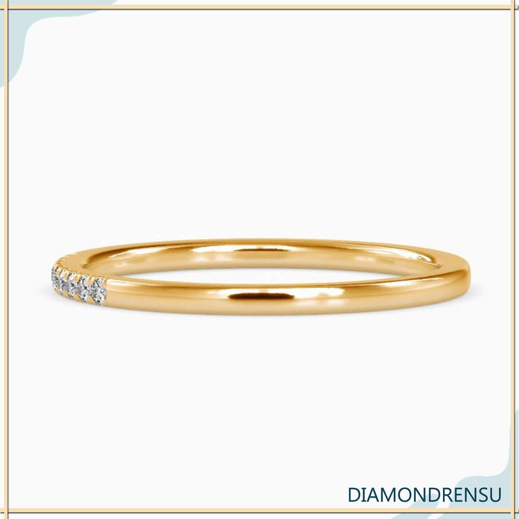 Lab diamond eternity ring in a minimalist band with handmade craftsmanship.
