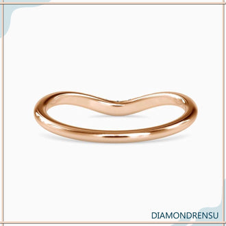 Rose gold curved wedding band with seven round diamonds
