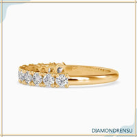 Handmade half eternity band with shared prong setting and IGI certified diamonds.
