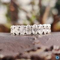 Exquisite oval band with a modern prong setting, allowing the moissanite brilliance to shine.
