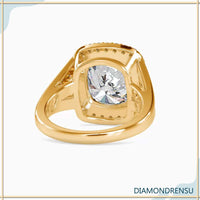 Cushion cut halo diamond ring featuring a split shank engagement ring design.
