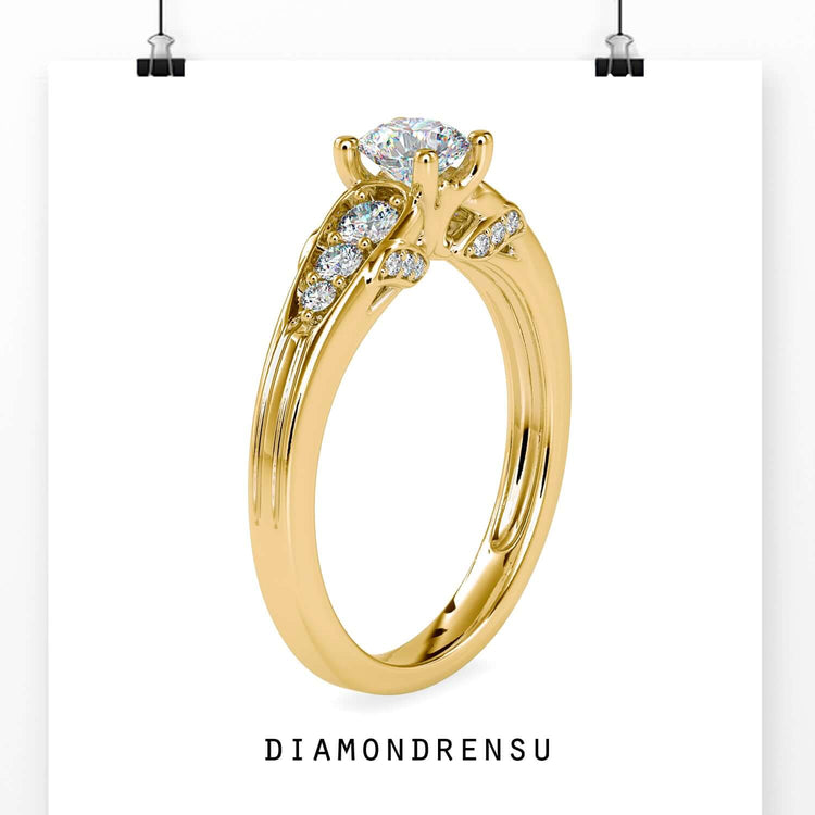 Round engagement ring with side stones and a four prong diamond setting.
