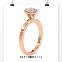 Round solitaire engagement ring with a 6 prong setting and IGI certified diamond.