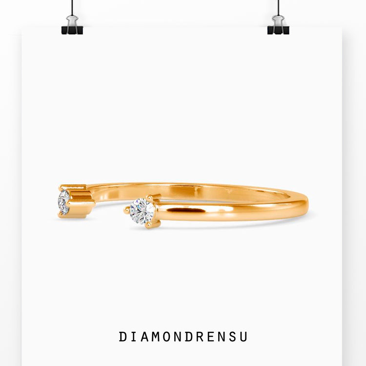 Open cuff wedding band with a delicate and dainty two stone setting.
