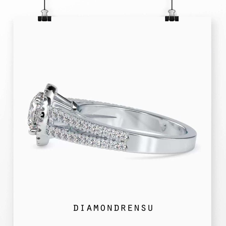 Round halo ring with a split shank setting, showcasing handmade jewelry craftsmanship.
