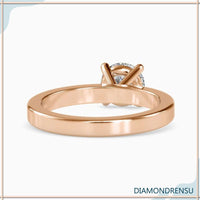Exquisite simple solitaire ring with a secure basket setting for everyday wear.