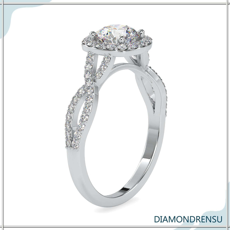 Gold halo ring with pave accents and a twisted band.
