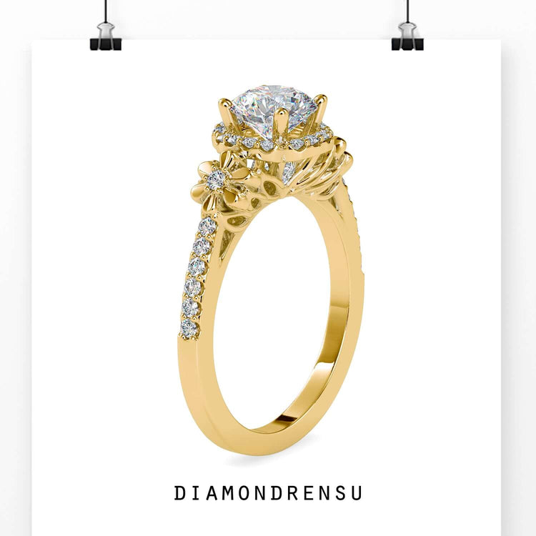 Floral engagement ring with a halo and round diamond center.
