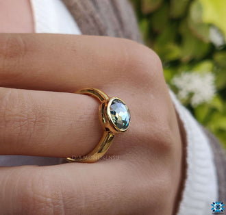 Bezel set solitaire engagement ring for a timeless proposal.