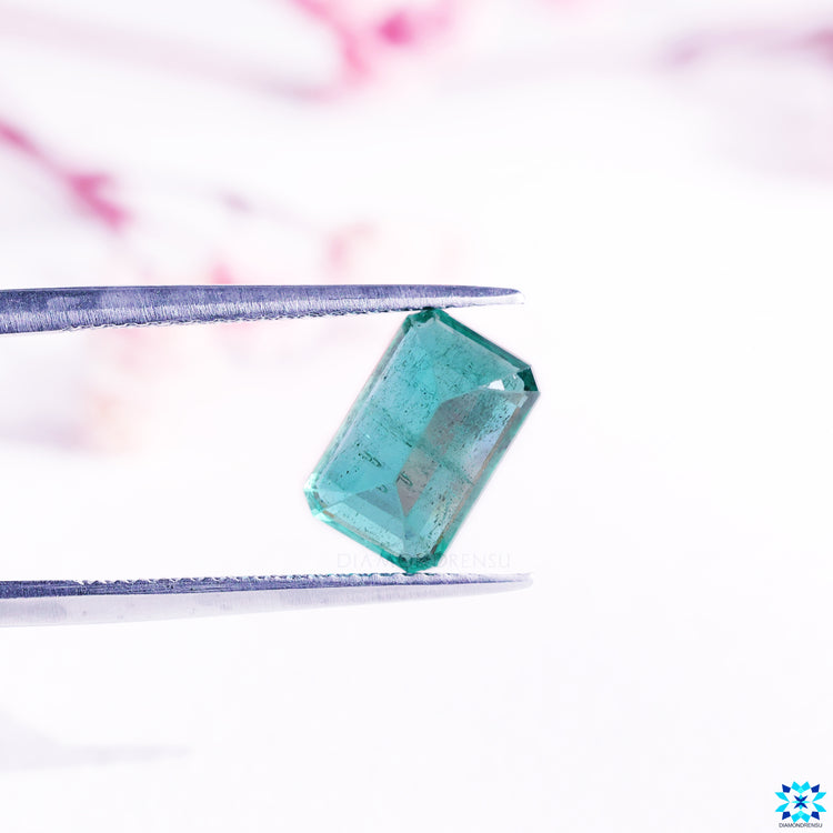 May birthstone emerald in emerald cut gemstone form.
