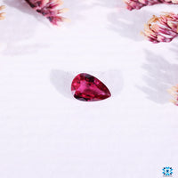 Pink ruby gemstone pear cut birthstone.
