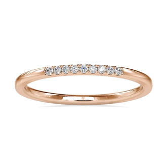 Round diamond gold band with minimalist design in yellow gold.
