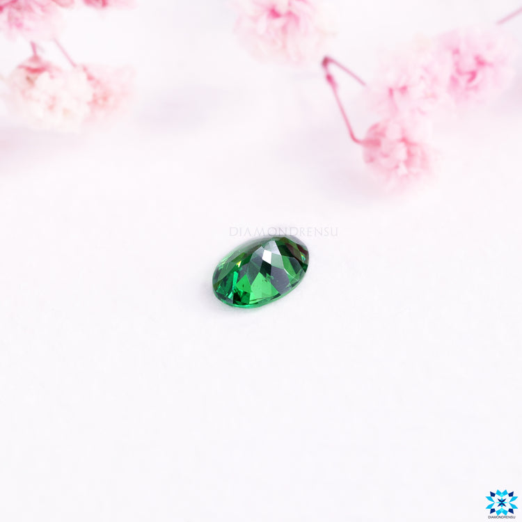 Oval cut gemstones featuring green gemstone color.
