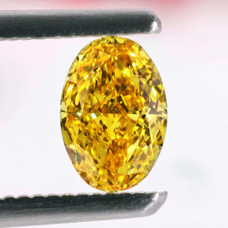 Oval yellow diamond in 0.70 carat weight with lab grown clarity.
