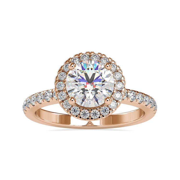 Pave engagement ring with a round halo setting and a handmade ring design.

