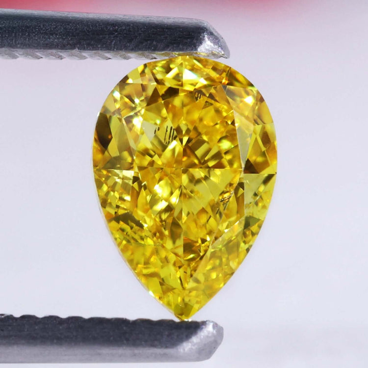 Pear shape yellow diamond in 1.10 carat lab grown style with IGI certification.
