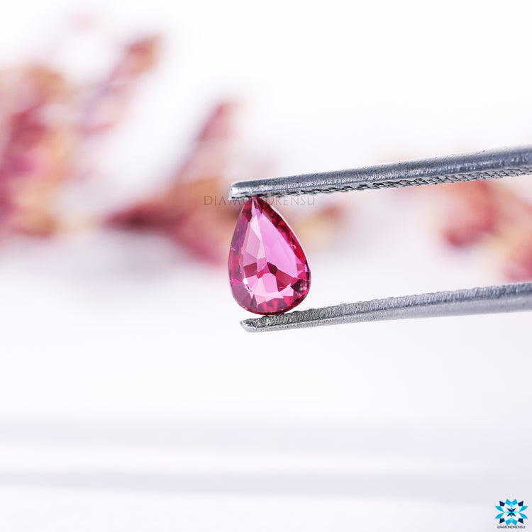 Pear cut birthstone pink ruby gemstone.
