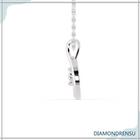 The diamond pendant necklace shines with brilliant clarity.
