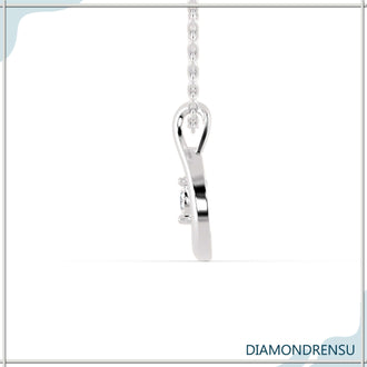 The diamond pendant necklace shines with brilliant clarity.

