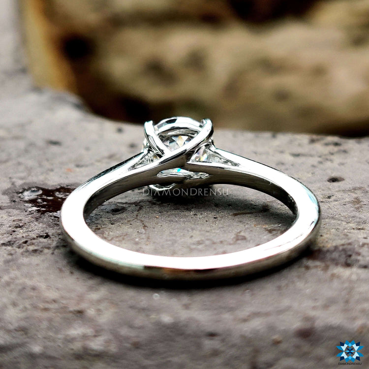Exquisite round moissanite engagement ring in a delicate setting.
