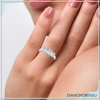 Three stone diamond ring with a princess cut center and side stones
