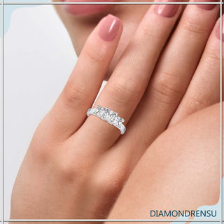 Three stone diamond ring with a princess cut center and side stones
