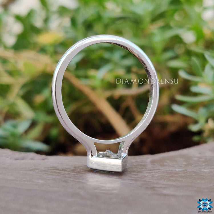 Moissanite bezel ring with a sleek and contemporary style.
