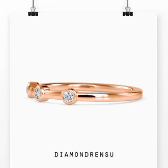 Lab grown diamond wedding band in a bezel setting, elegant design
