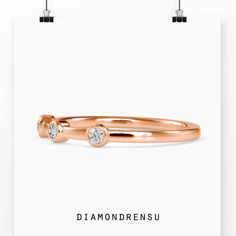 Lab grown diamond wedding band in a bezel setting, elegant design
