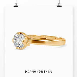 Ring accents with round solitaire diamond, beautifully set in gold.