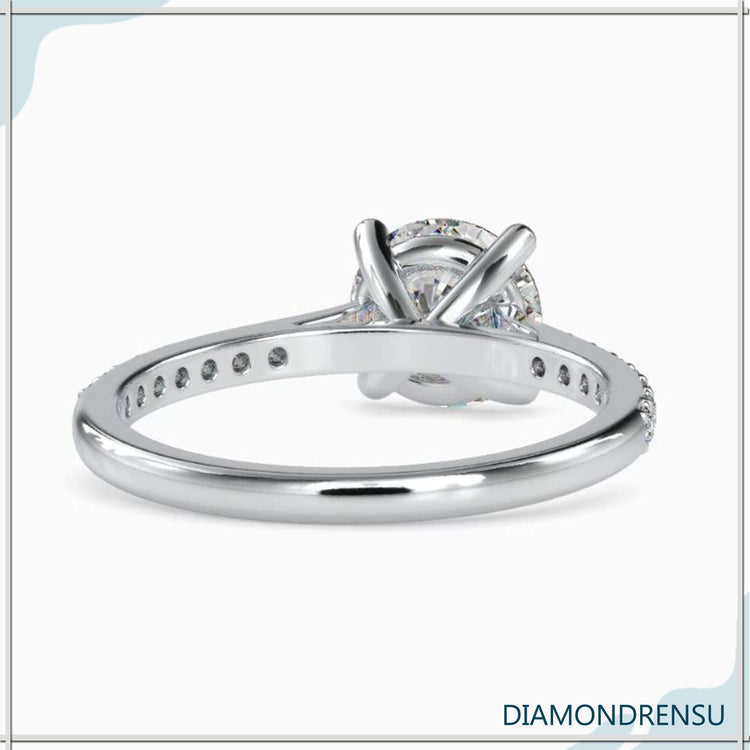 Cathedral style engagement ring with a pave engagement ring setting and a Lab Grown Diamond.