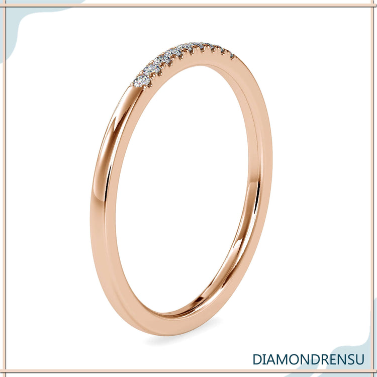 Lab diamond band with u shaped prong setting in a gold eternity band.
