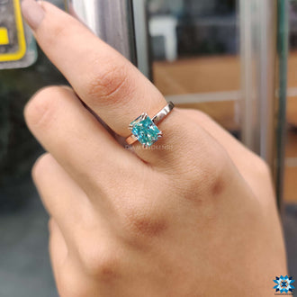 Moissanite solitaire ring with radiant cut stone, showcasing premium craftsmanship.
