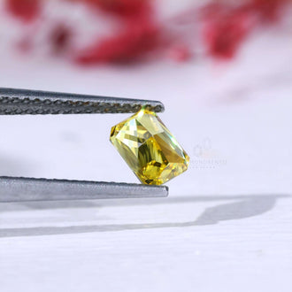 0.70 carat loose radiant cut diamond yellow color.

