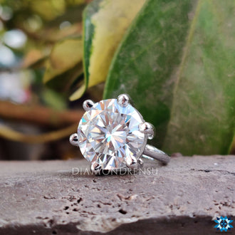 Round cut moissanite engagement ring for everlasting charm.
