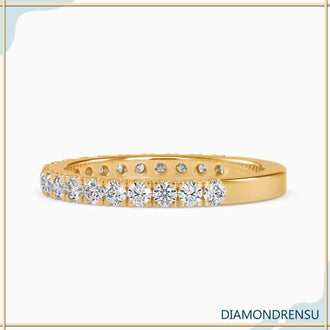 Pave diamond semi eternity wedding band with round brilliant cut diamonds.
